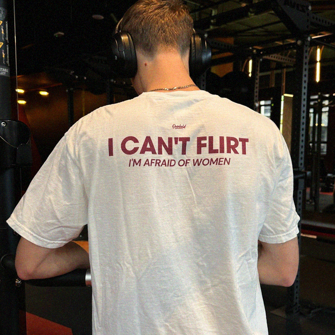 Person wearing a white t-shirt with humorous text in a gym setting